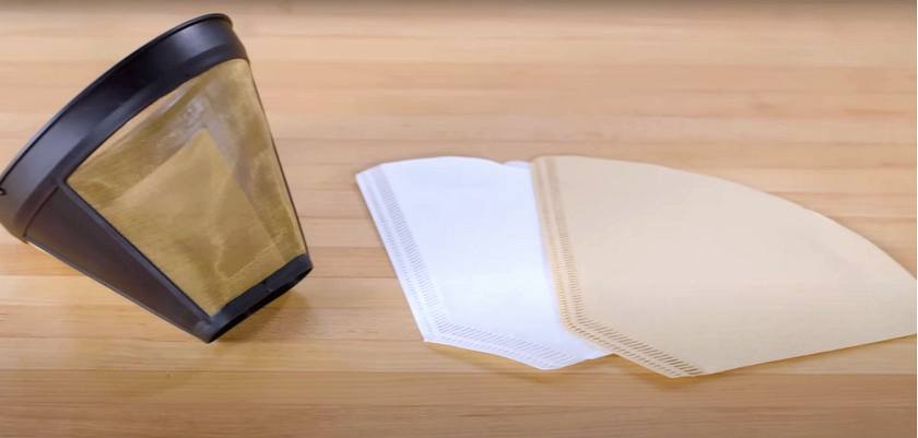 paper filters and a mesh filter on a table